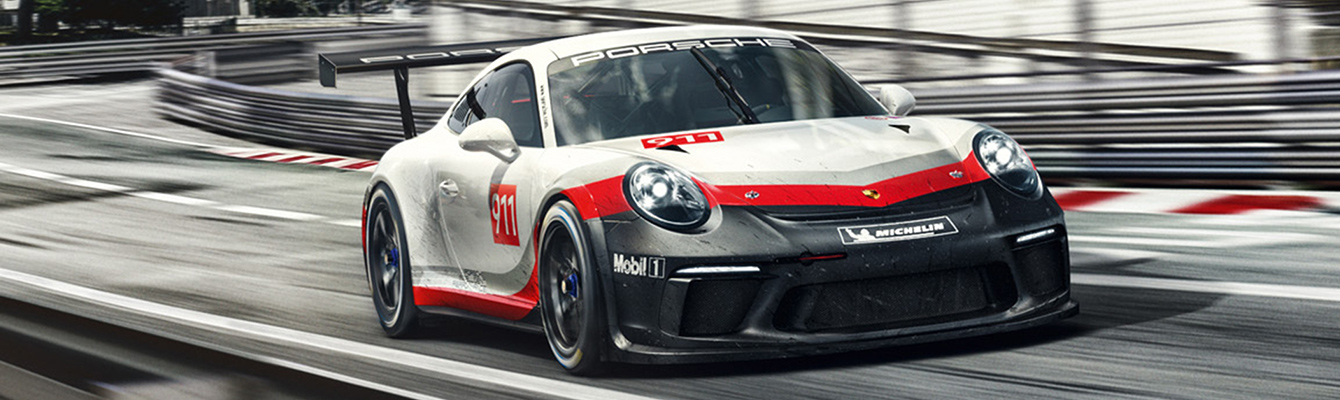 Porsche Driving Down Street